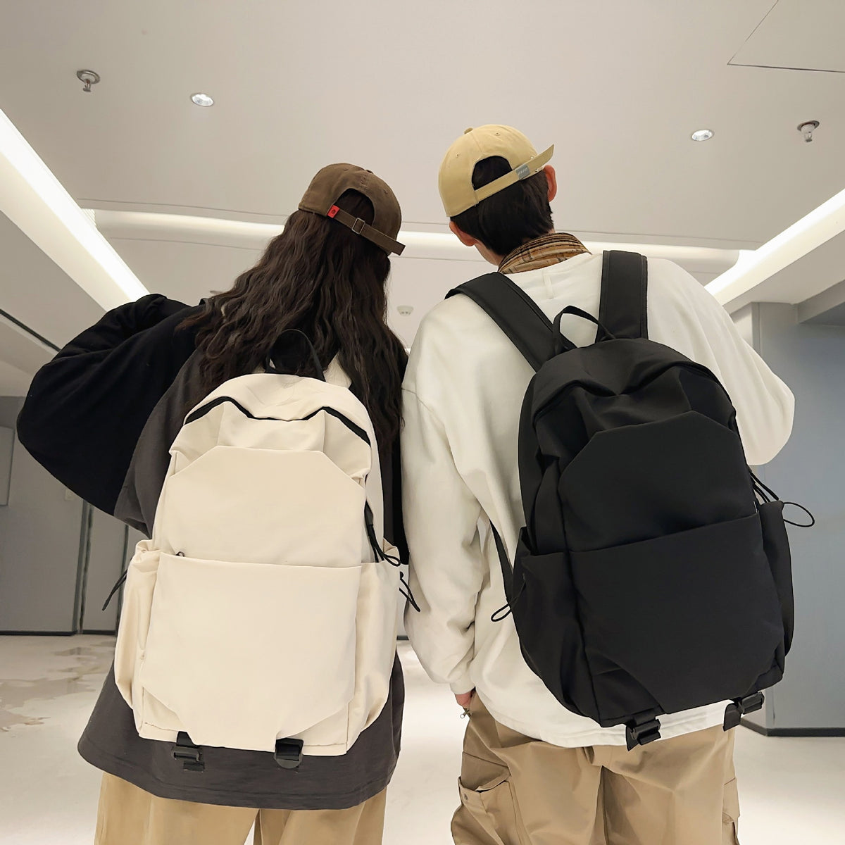 Everyday backpack with ergonomic carrying system and multifunctional pockets