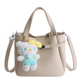 mini handbag with fluffy pendant