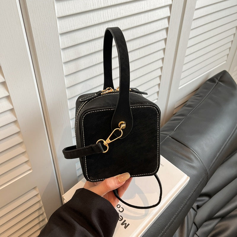 Women’s mini handbag with detachable shoulder strap and elegant flap closure