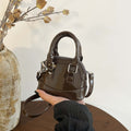 mini handbag with shiny surface and trendy zipper