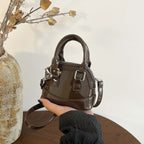 mini handbag with shiny surface and trendy zipper