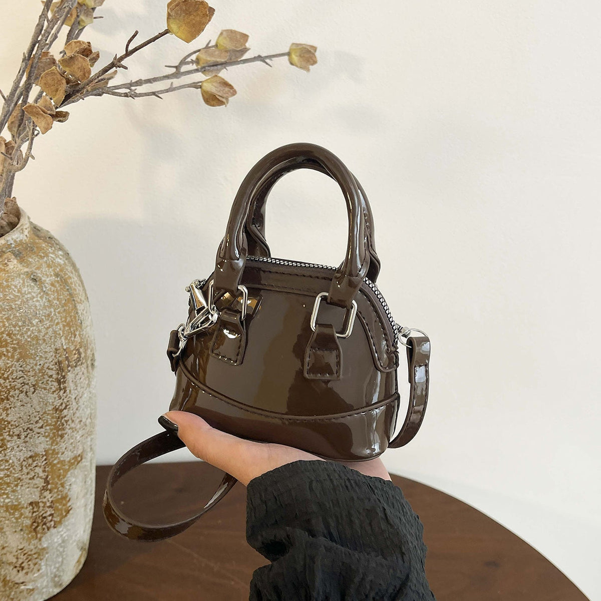 mini handbag with shiny surface and trendy zipper