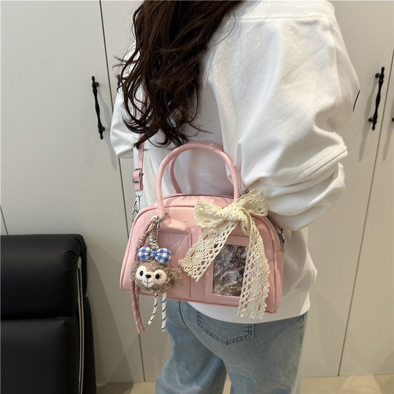 mini handbag with playful animal design and charming pendant