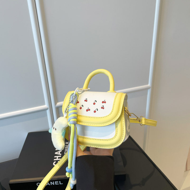 mini handbag with cheerful cherry design and charming charms