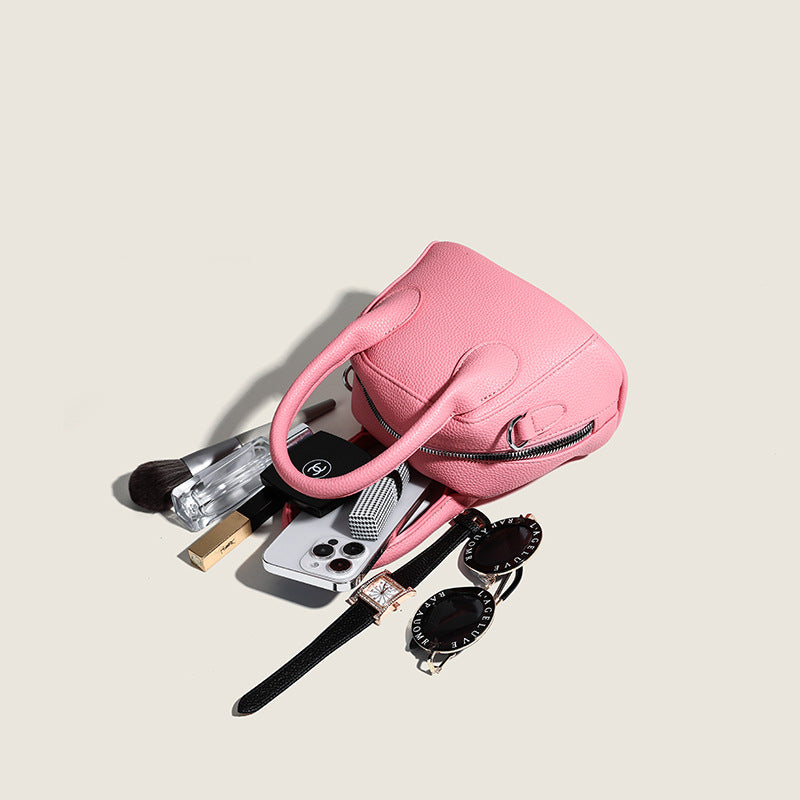mini handbag with textured upper material and removable shoulder strap