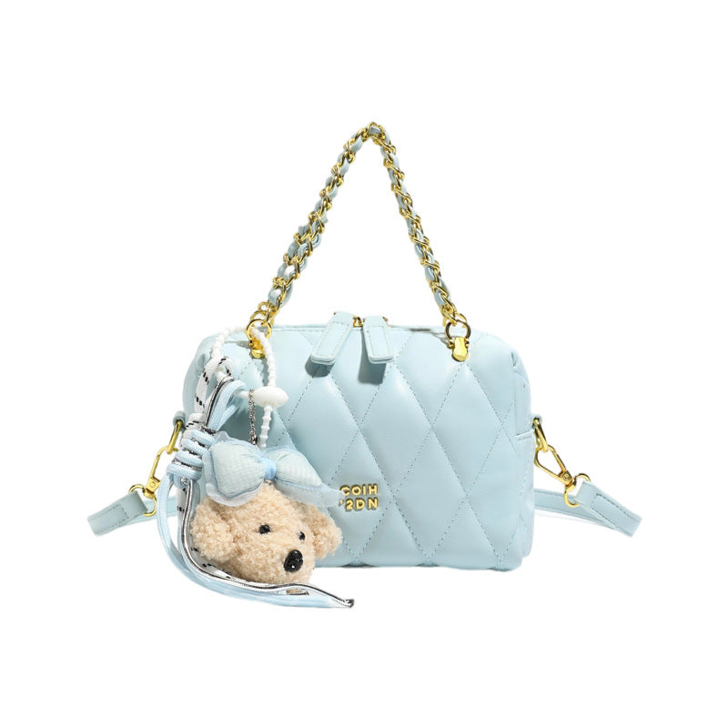 stylish mini handbag with playful animal pendant