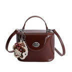 Ladies elegant mini handbag with stylish pendant