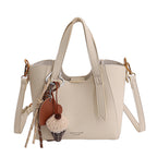 Ladies mini handbag in elegant design with charming pendant