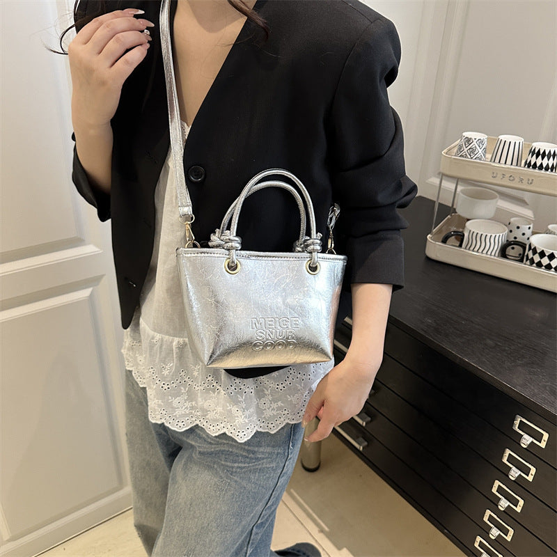 elegant mini handbag with textured design and detachable shoulder strap