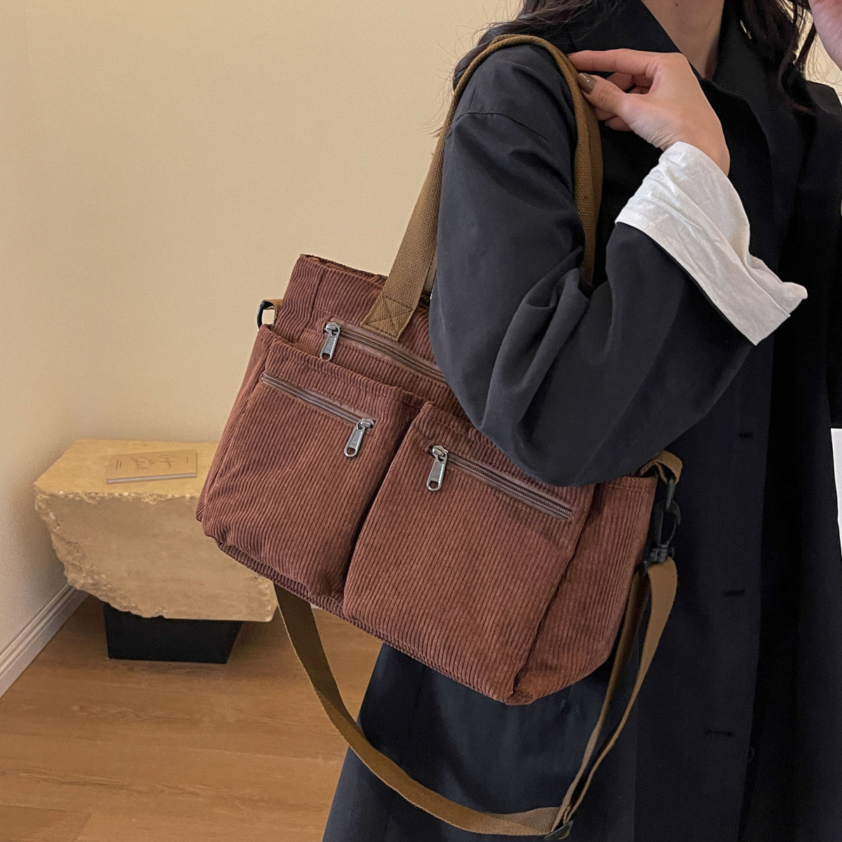 Durable shoulder bag with multiple compartments