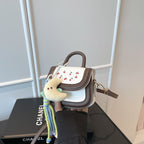 mini handbag with cheerful cherry design and charming charms