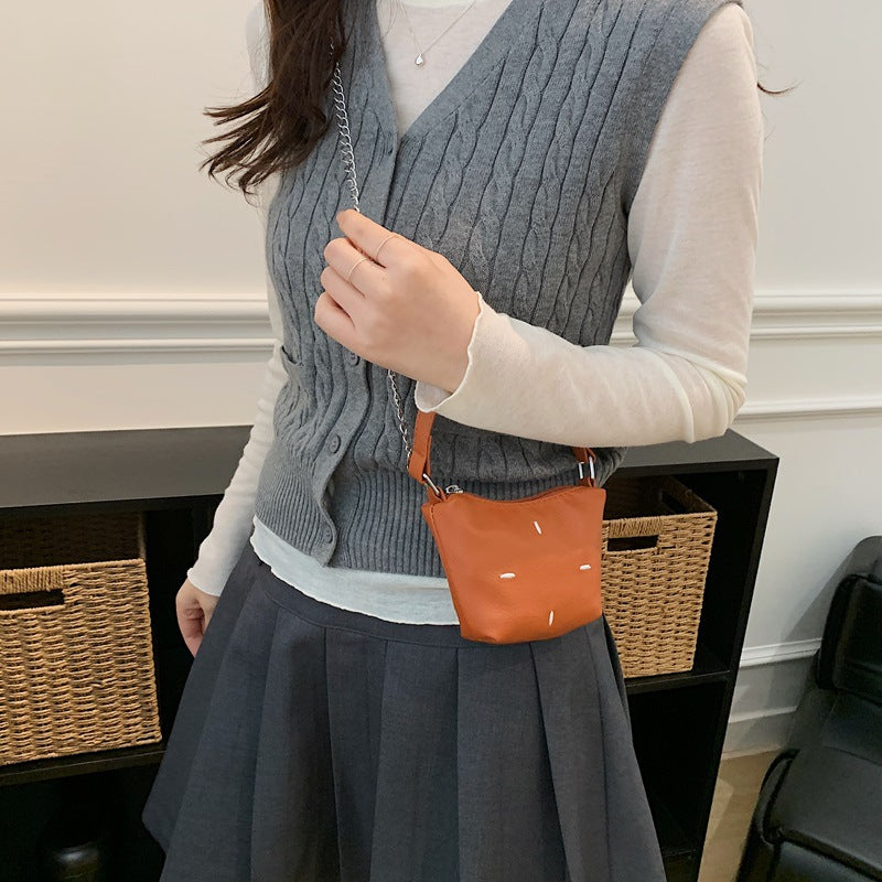 mini handbag with shiny chain and textured upper material