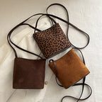Ladies mini handbag made of soft suede with stylish carrying handle