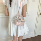 Women’s mini handbag with playful design and elegant accents