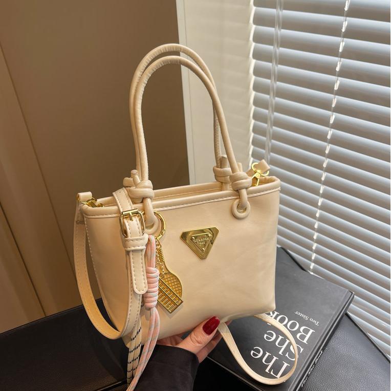 Mini handbag with elegant details and practical shoulder strap