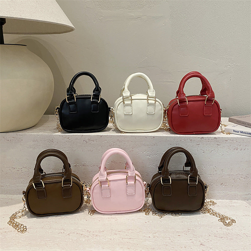 mini handbag with detachable chain and elegant design