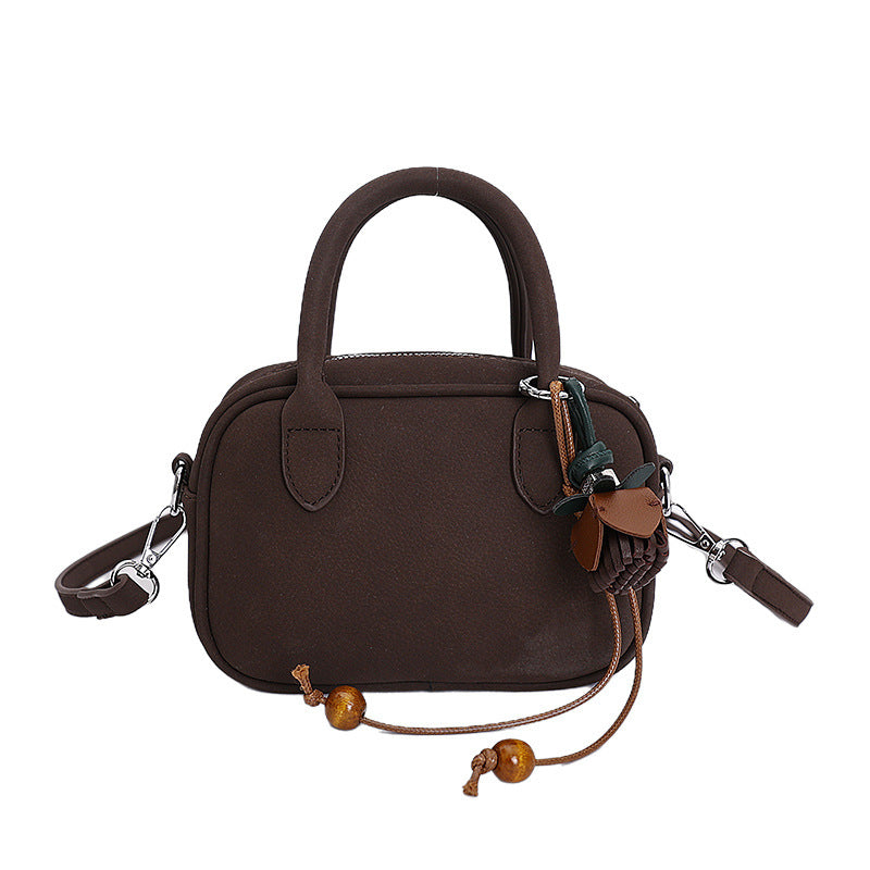 mini handbag with detachable shoulder strap and elegant design