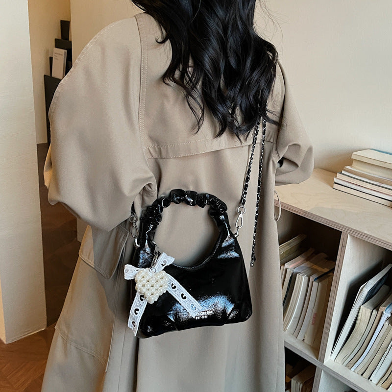 mini handbag with voluminous ruffle design and trendy pendants