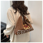 Shoulder bag in playful bear pattern