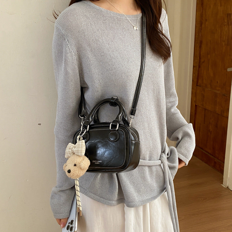 Women’s mini handbag with detachable plush pendant