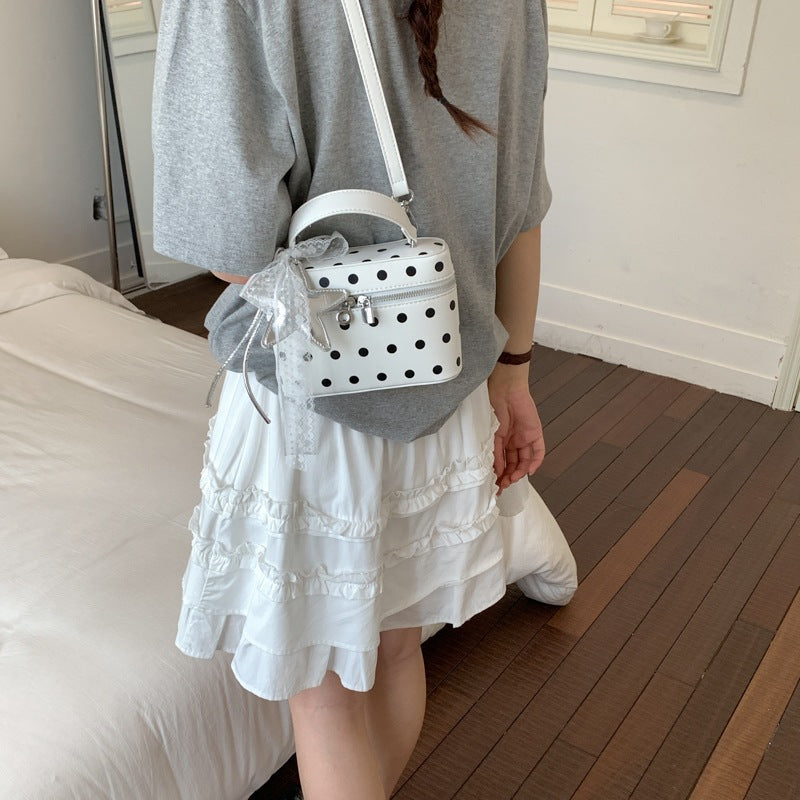 Women’s mini handbag with playful design and elegant accents