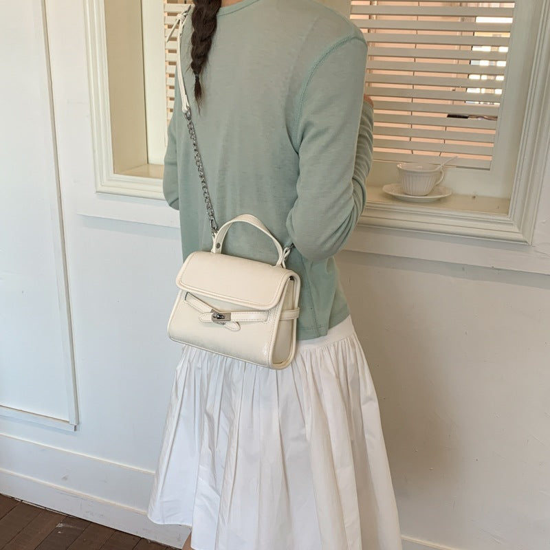 Women’s fashionable mini handbag with decorative magnetic closure