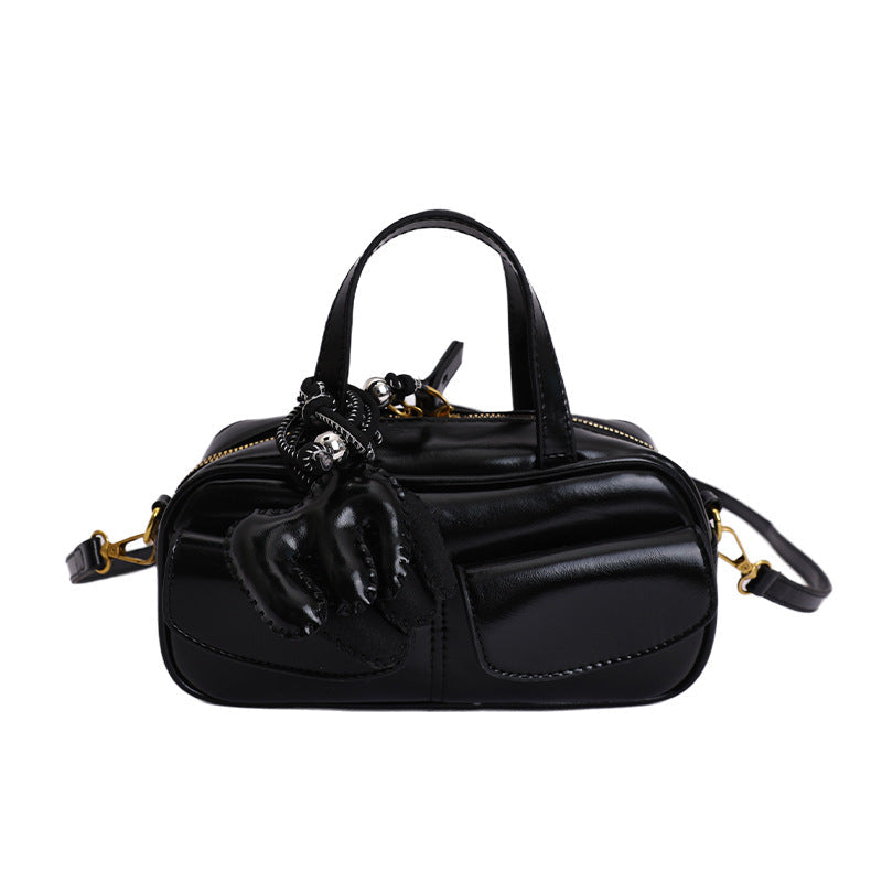 playful mini handbag with charming animal charm
