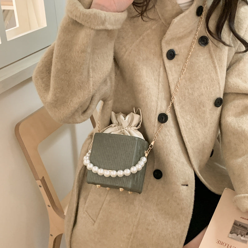 Women stylish mini handbag with drawstring and pearl accent Nord bags