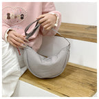 Shoulder bag with adjustable shoulder strap and practical compartments