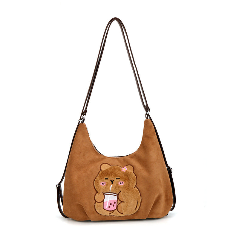 Shoulder bag with playful bear motif