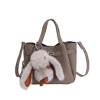 Ladies mini handbag with playful design and animal pendant