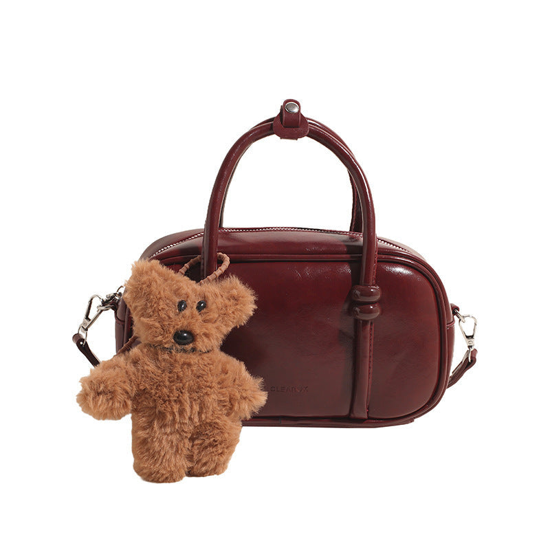 mini handbag with charming bear pendant