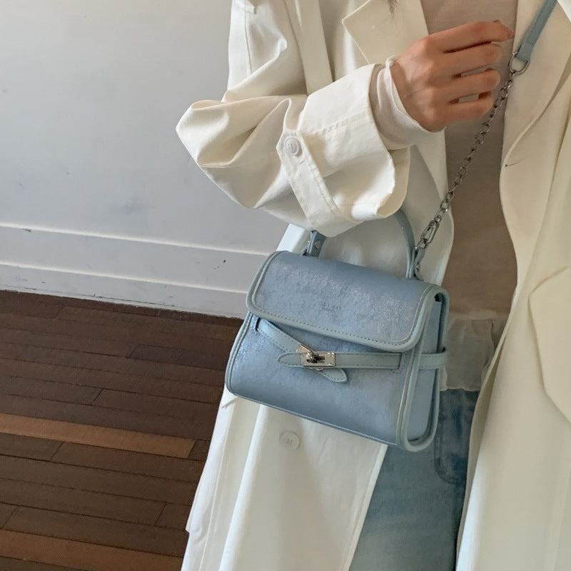 Women’s fashionable mini handbag with decorative magnetic closure