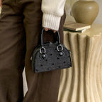 mini handbag made of high-quality material with a textured surface