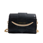 mini handbag with modern crocodile embossing and chic magnetic closure