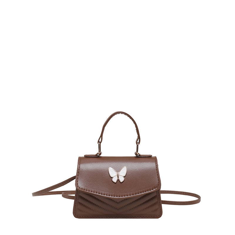 Chic Mini Handbag with Elegant Butterfly Accent