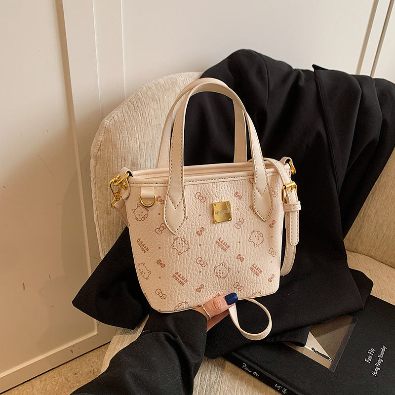 Women’s mini handbag in a charming design with removable pendant