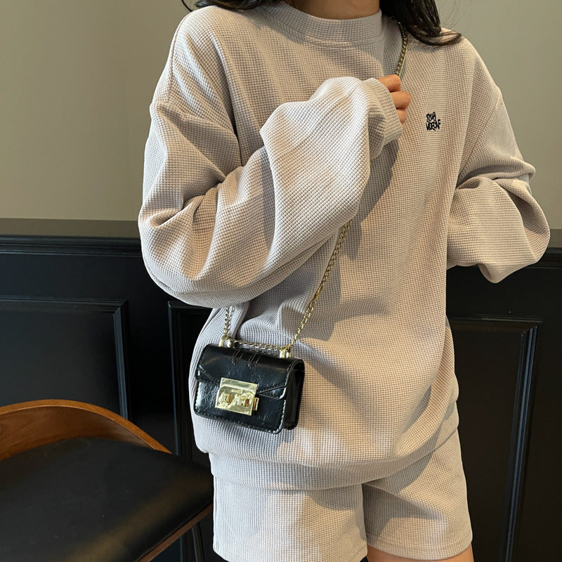 elegant mini handbag with gold closure mechanism
