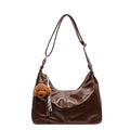 Shoulder bag with charming animal pendant
