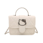 mini handbag with decorative quilting and playful cat motif