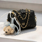 stylish mini handbag with playful animal pendant