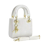 elegant mini handbag in modern snake leather look with detachable shoulder strap