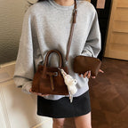 mini handbag with modern accents and practical interior organizer