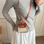 Women’s Mini-Handbag with luxurious leather look and practical carrying handles