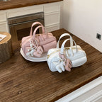 playful mini handbag with charming animal charm