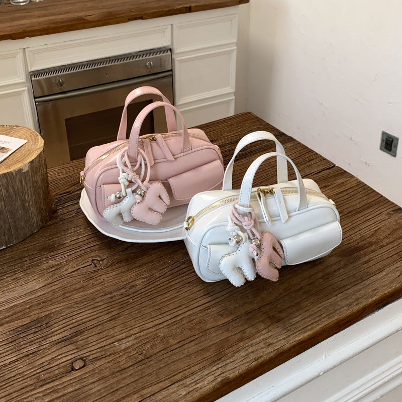playful mini handbag with charming animal charm