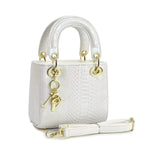 elegant mini handbag in modern snake leather look with detachable shoulder strap