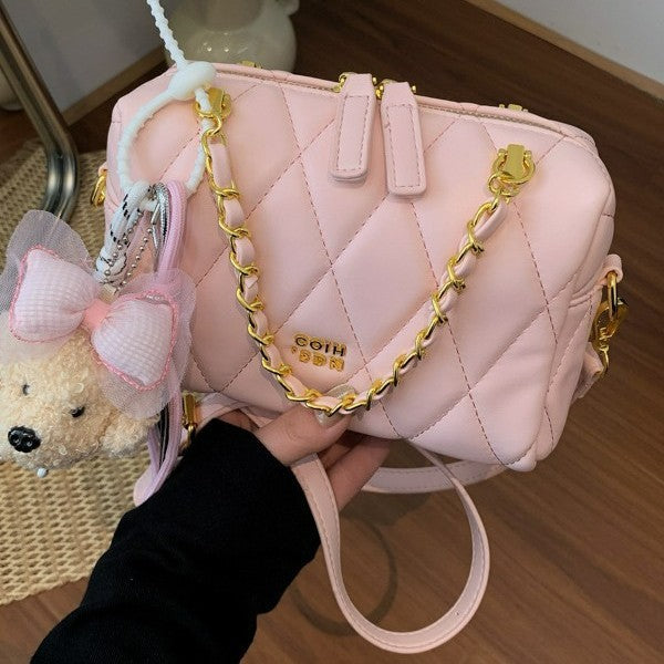 stylish mini handbag with playful animal pendant