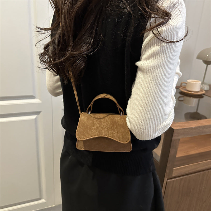 Ladies mini handbag with detachable carrying handle