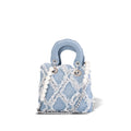 mini handbag with striking cinched design and pearl accents